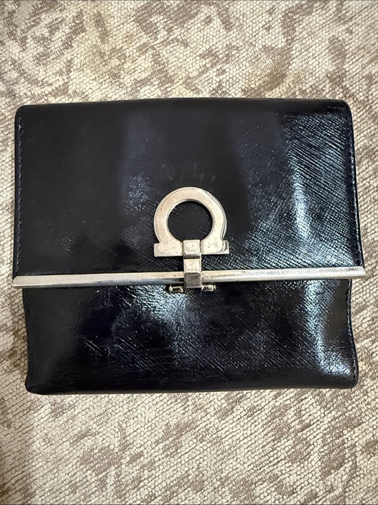 Salvatore Ferragamo Handbags - Salvatore Ferragamo EUC black leather wallet featuring Gancini clip closure